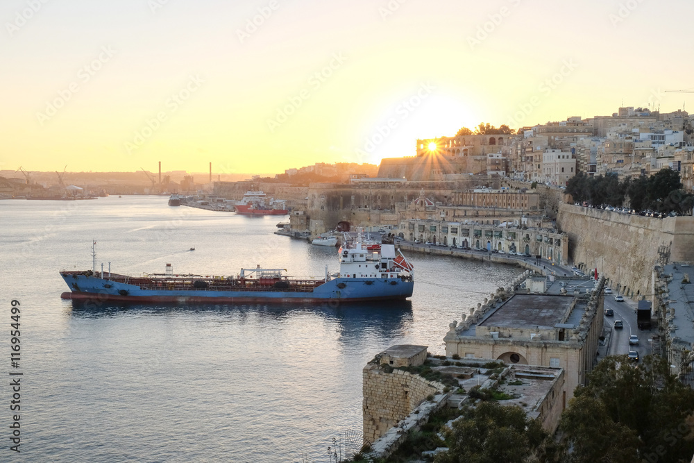 Sunset in Valleta, Malta. Old harbour at sunset with overview of