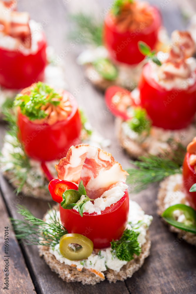 Canapes with stuffed cherry tomatoes 