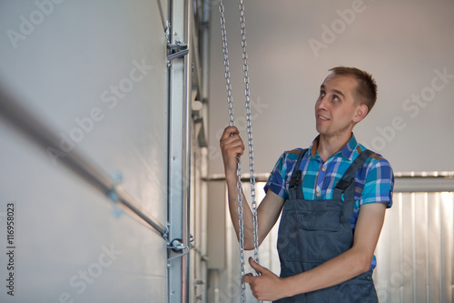 Mechanic open a garage door