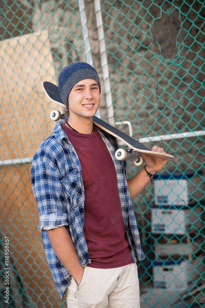 Handsome guy with skateboard