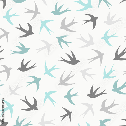 Seamless pattern with a flock of swallows. Vintage background of silhouettes of birds in the sky. Vector illustration.