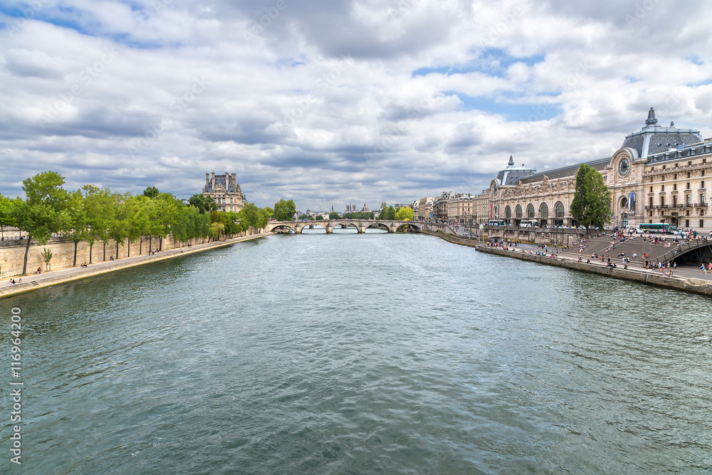 Paris. Embankment Seine River (UNESCO World Heritage Site). On the right side - Museum d'Orsay on the left - the Louvre.