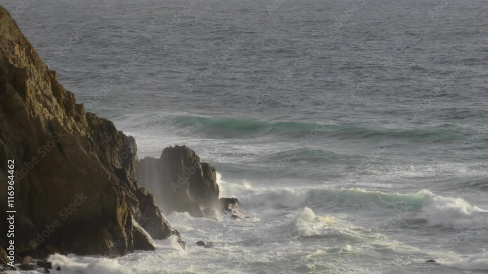 Wave Crashing onto the rocky shore of Pacific Ocean California Wave Crashing onto the rocky shore of Pacific Ocean California