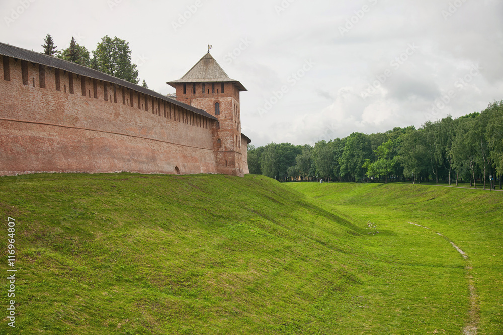 Veliky Novgorod. View of the Kremlin wall, ditch and towers.