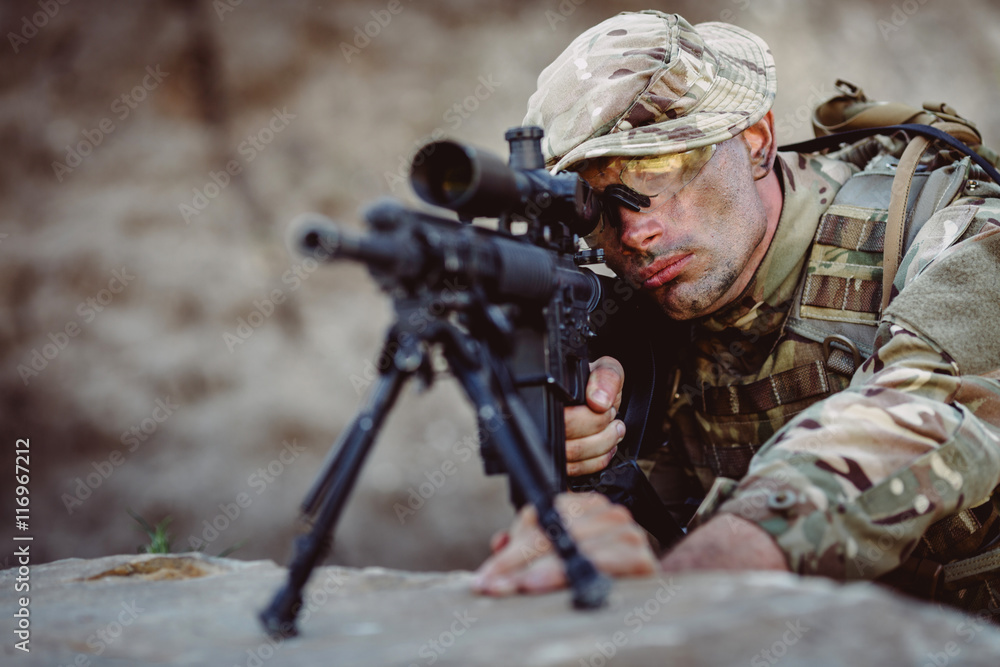 Army sniper during the military operation in the mountain. Army sniper during the military operation in the mountain.
