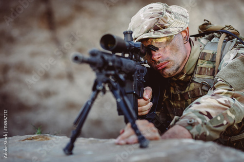 Army sniper during the military operation in the mountain.