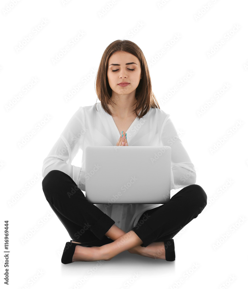 Businesswoman with laptop relaxing in meditation pose, isolated on white Businesswoman with laptop relaxing in meditation pose, isolated on white