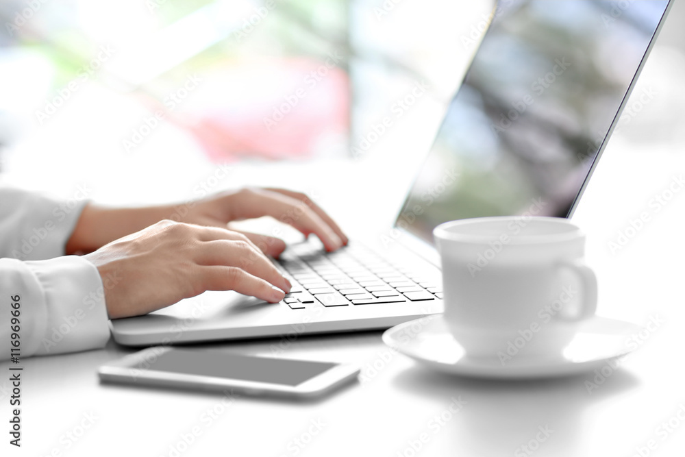 Woman typing on laptop Woman typing on laptop