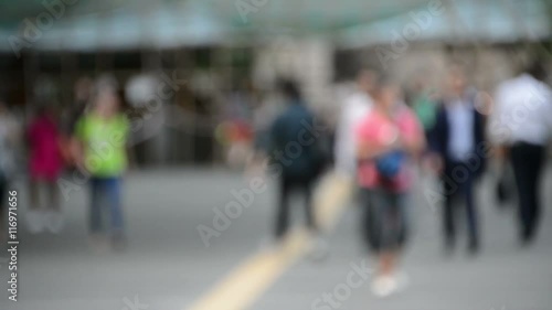 Blurred people walking in front of the camera