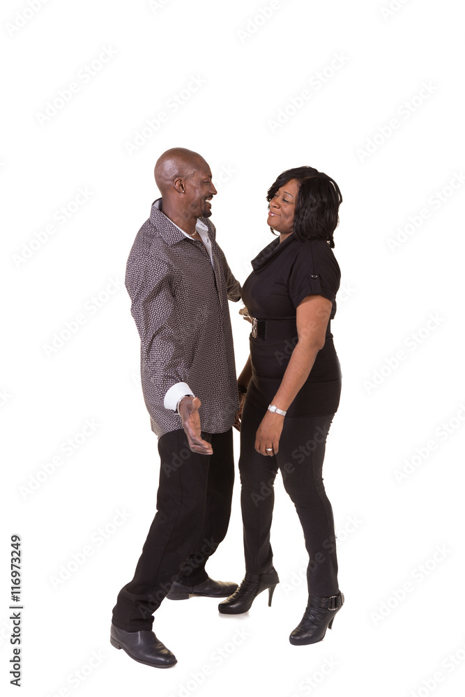 Middle aged couple standing close interacting Middle aged couple standing close interacting