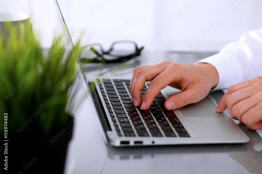 Close-up of Business woman is typing on laptop computer Close-up of Business woman is typing on laptop computer
