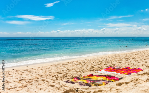 Fototapeta Naklejka Na Ścianę i Meble -  Two towels on a tropical sandy beach.