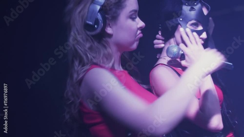 Wallpaper Mural Dj girl and mc girl spinning at turntable in nightclub. Perform. Illuminations. Headphones. Torontodigital.ca