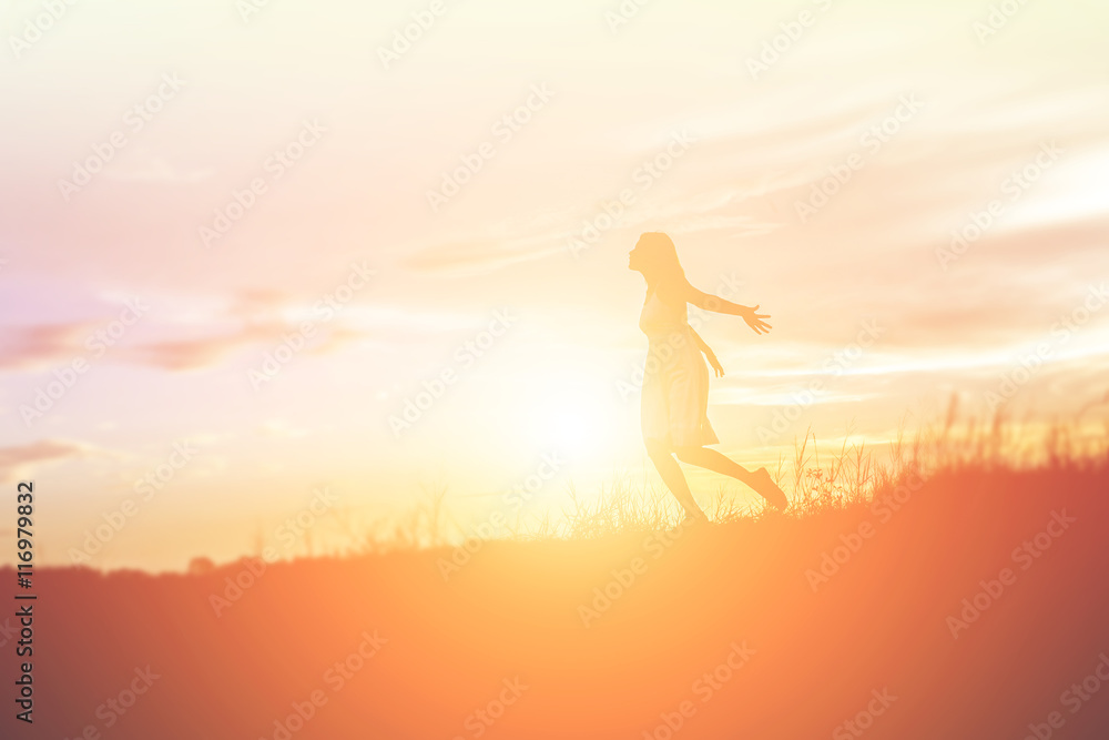 Silhouette of a beautiful girl jumping