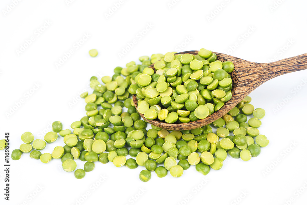 Close up dried peeled split green bean on a white background. Close up dried peeled split green bean on a white background.