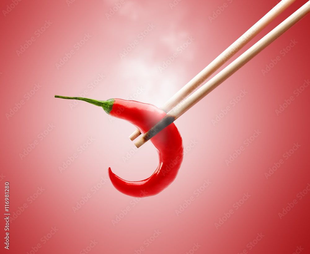 Burnt Chopsticks in Smoke While Pinching Hot Chili Pepper Burnt Chopsticks in Smoke While Pinching Hot Chili Pepper
