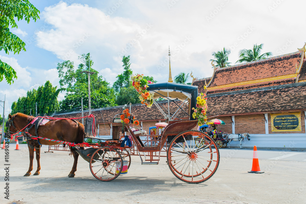 Fototapeta premium Traditional Horse Carriage ride in Wat Phra That Lampang Luang ,