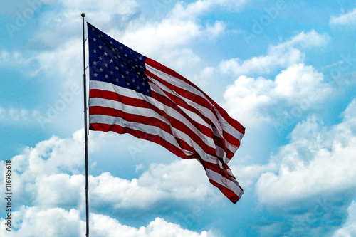American Flag with Blue Sky Background