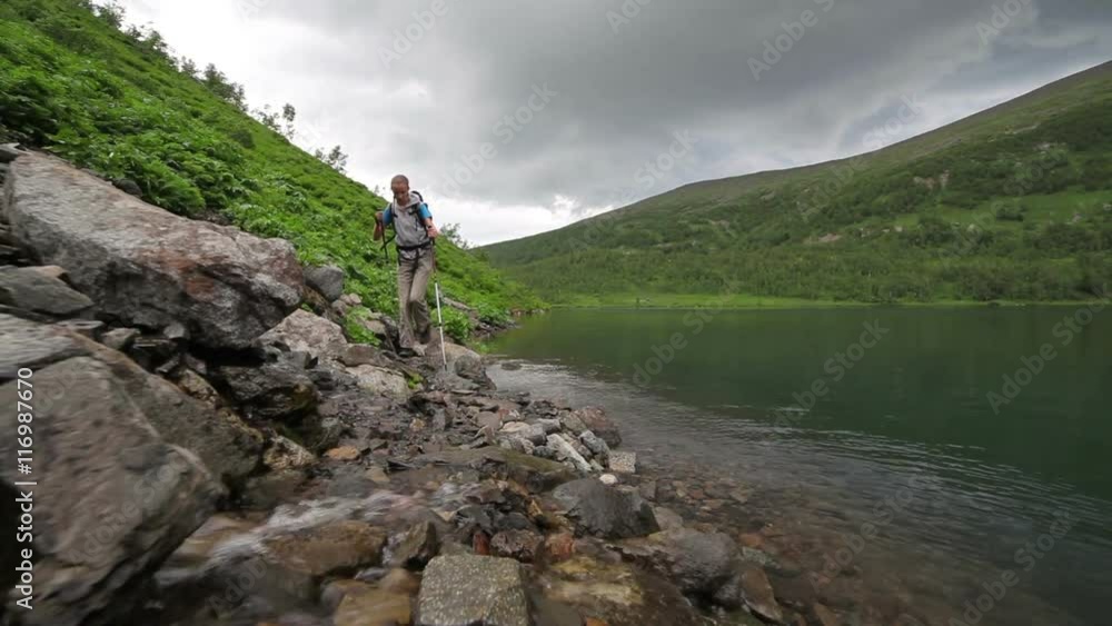 Hiker woman is walking mountain,
