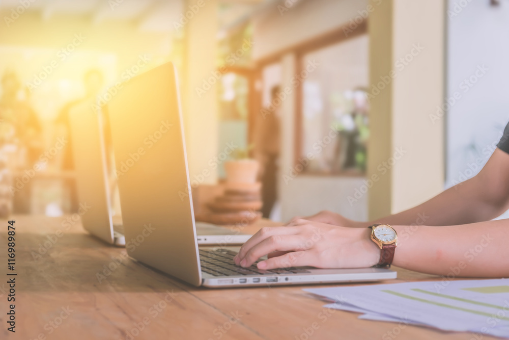 Fototapeta premium Close up young business women hands using laptop computer in hom