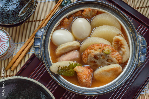 Oden is a Japanese winter dish consisting of several ingredients such as boiled eggs, daikon, konjac, and fishcakes stewed in a light, soy-flavored dashi broth. Ingredients vary according to region .