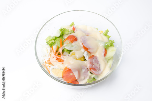 Fresh vegetable salad isolated on white ground.