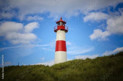 Lighthouse on the Dune. Lighthouse List East on a dune of the island Sylt, Germany, North Sea, strong vignette.