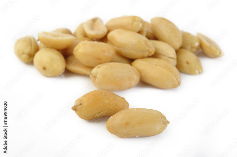 Peeled salted peanuts isolated on white background