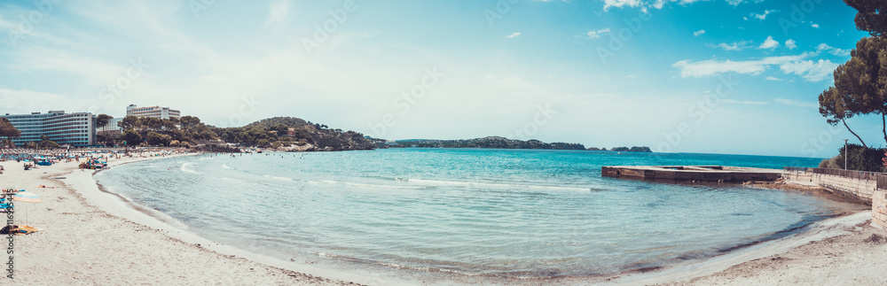 Wide panoramic view of ocean bay with beach