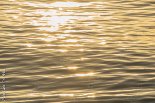 golden color water ripples.