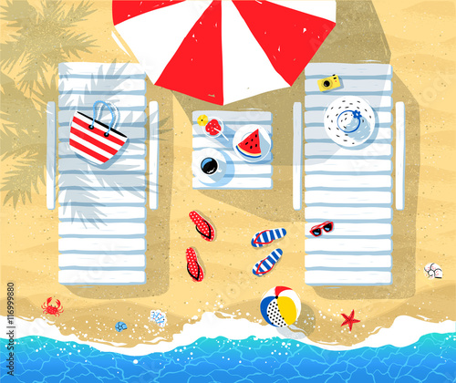 Sun beds and parasol on seaside
