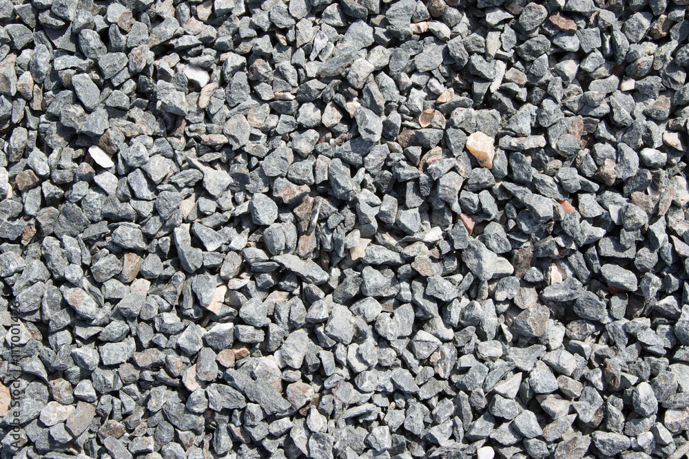 Background composed of crushed gravel fine fraction in sunlight Background composed of crushed gravel fine fraction in sunlight