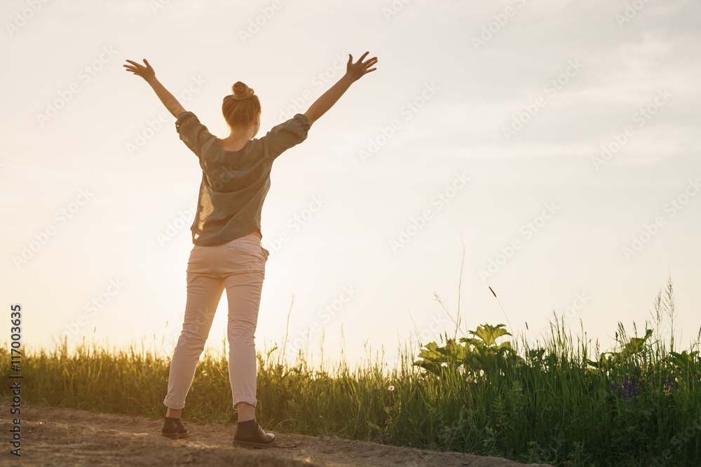 female teen girl stand feel freedom with arms stretched to the sky copy space for your info female teen girl stand feel freedom with arms stretched to the sky copy space for your info