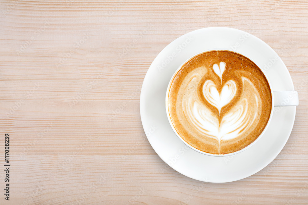 Top view latte art coffee on wood background Top view latte art coffee on wood background