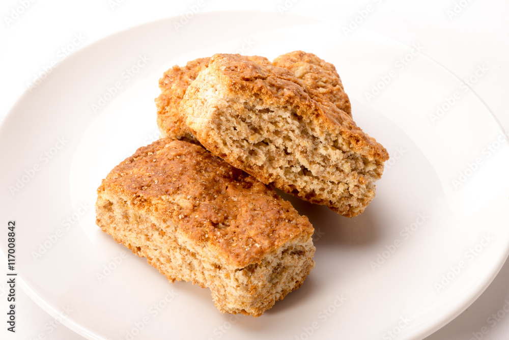 Whole wheat rusks on plate Whole wheat rusks on plate