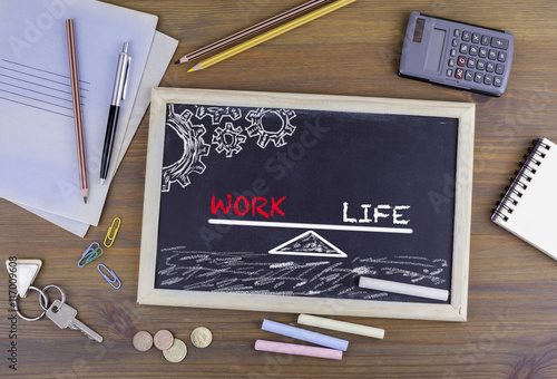 Work Life Balance. Chalkboard on wooden office desk