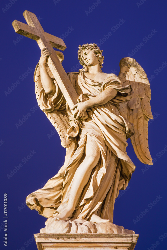 ROME, ITALY - MARCH 9, 2016: Statue of angel with the Cross in baroque style by sculptor Ercole Ferrata from Angel's Bridge.