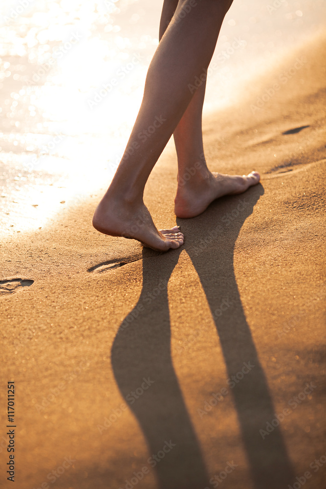 Walking barefoot on the beach
