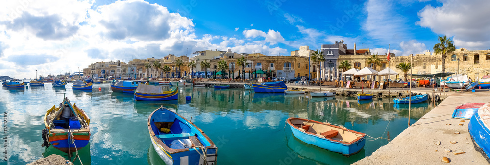 Marsaxlokk fishermen village in Malta. Panoramic view. - obrazy, fototapety, plakaty 