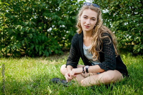 girl in black on the grass
