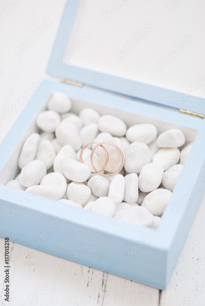 Wedding rings in blue box with white stone.Wedding ceremony Wedding rings in blue box with white stone.Wedding ceremony