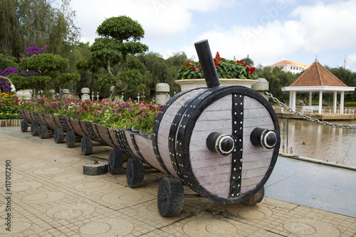 flowerbed in the shape of a train with flowers photo