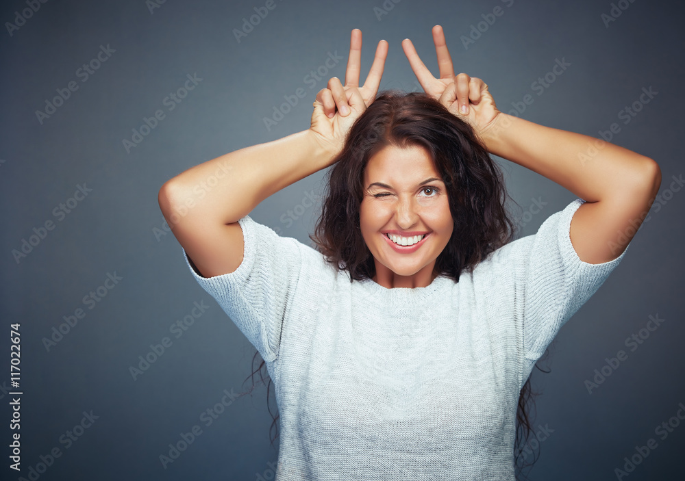 Young Woman On Grey Background Making Funny Gesture
