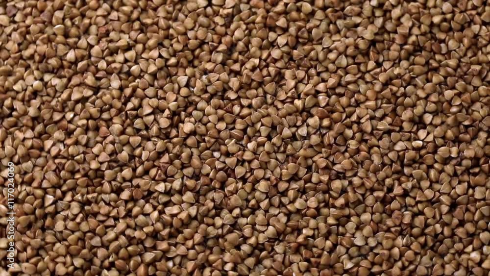Rotating raw buckwheat. Spinning closeup dry uncooked seeds. 1920x1080. Full HD
Rotating raw buckwheat. Spinning closeup dry uncooked seeds. 1920x1080. Full HD