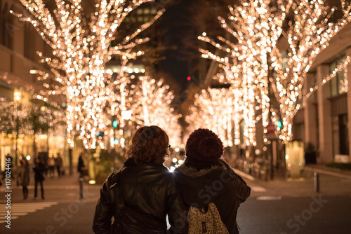 Asian couple with Christmas lights in Marunouchi, Tokyo © wooooooojpn