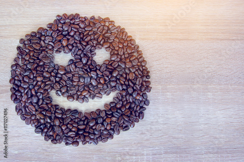 coffee beans spread out in the form of a smile © blindturtle