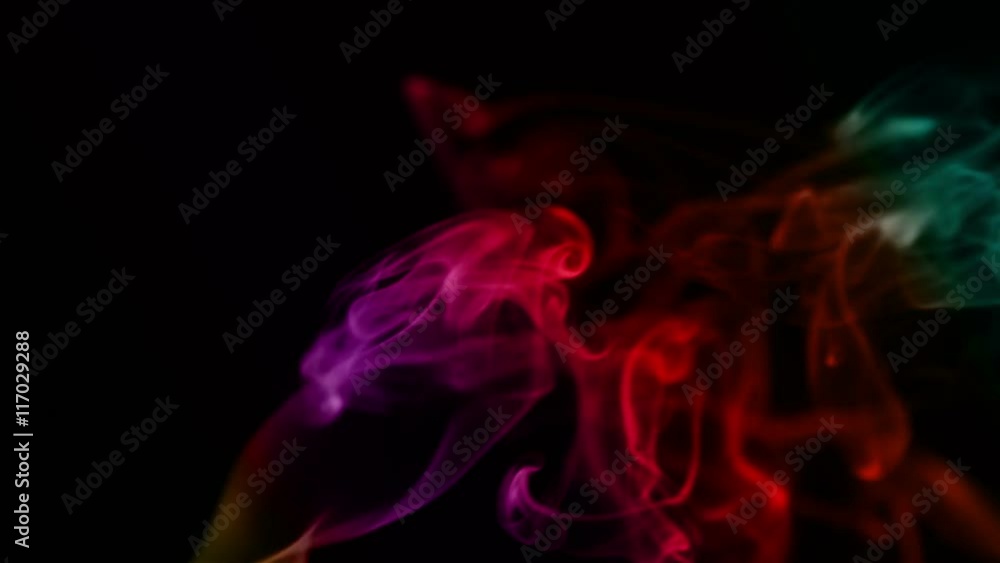 abstract color smoke flowing on black background