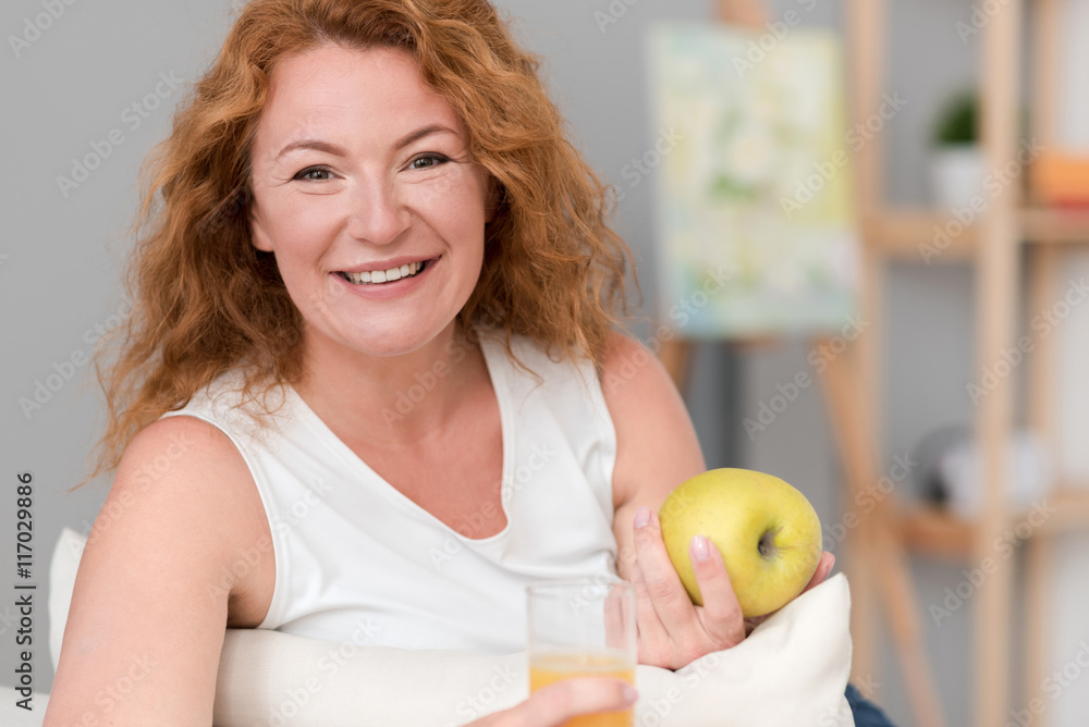 Cheerful woman resting at home Cheerful woman resting at home