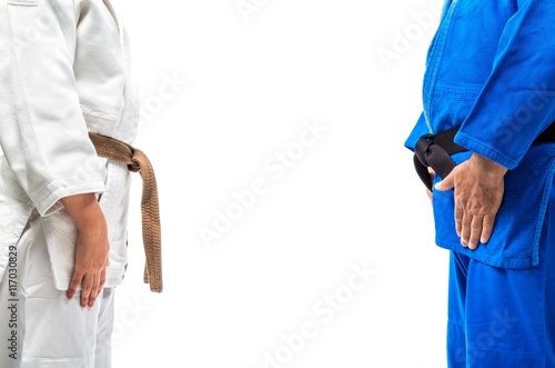 Standing bow of female judo brown belt to her sensei black belt