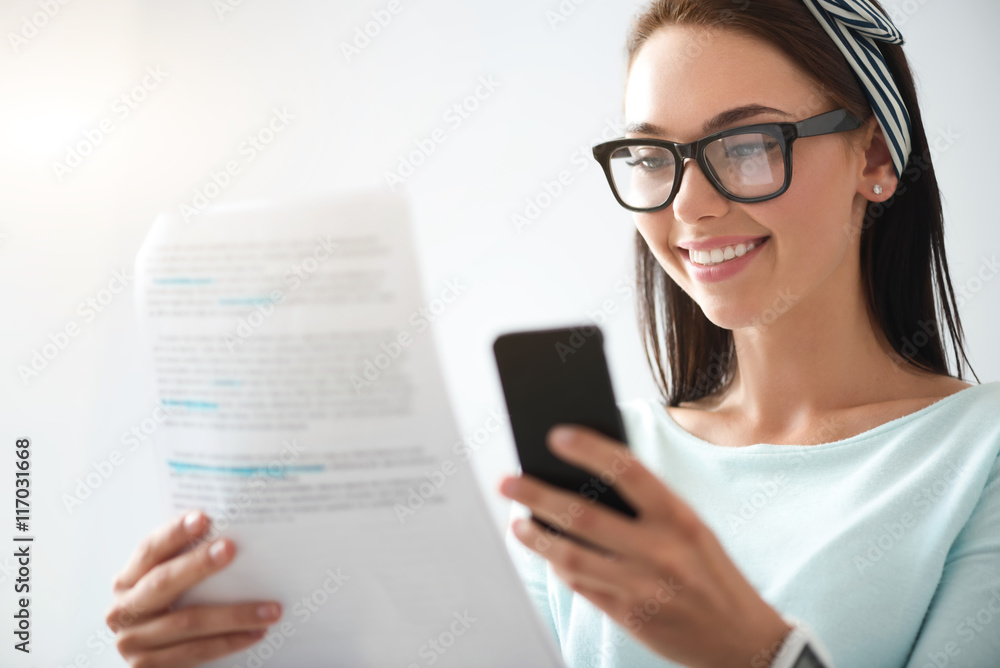 Positive woman using cell phone